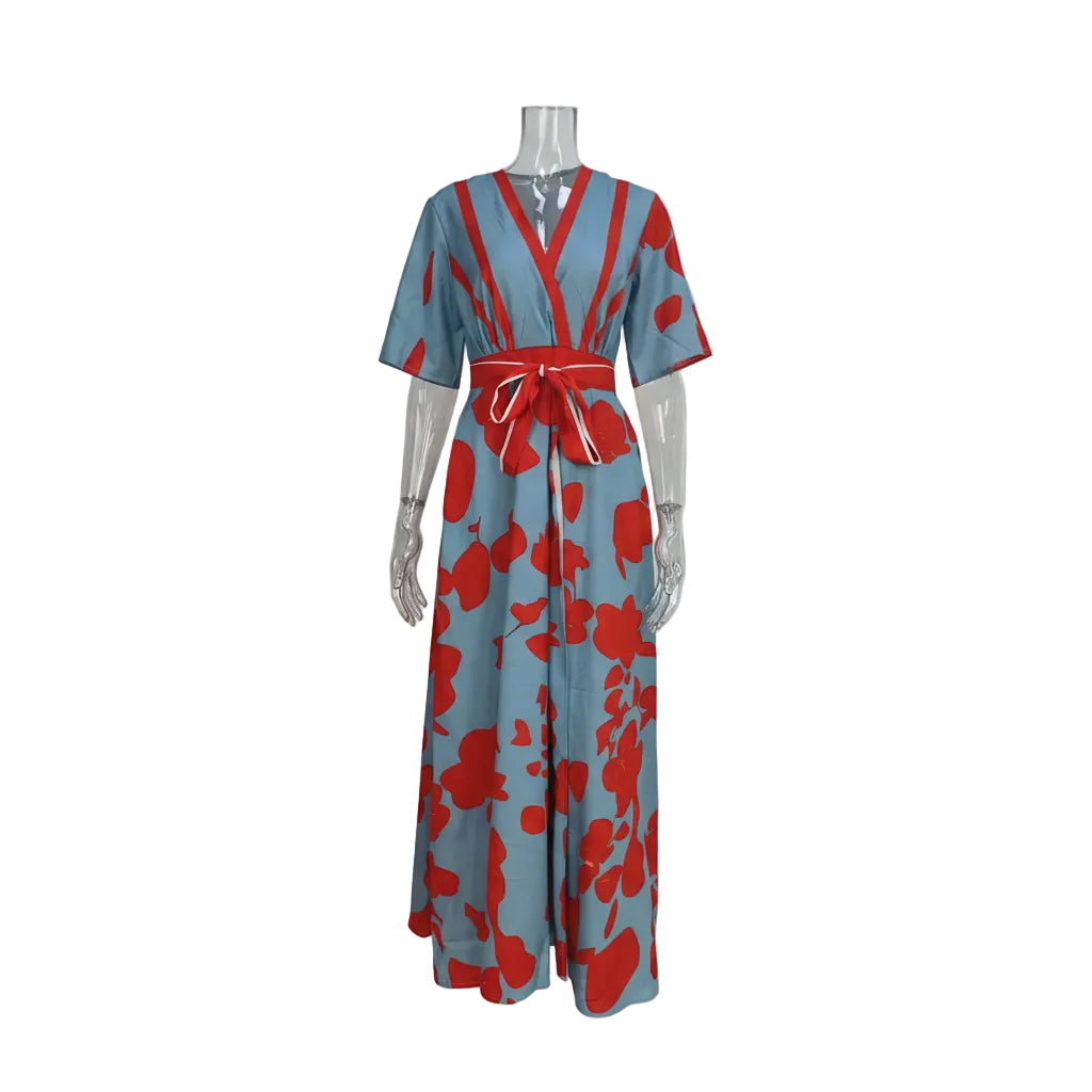 Mannequin wearing a blue dress with red floral patterns on a plain background