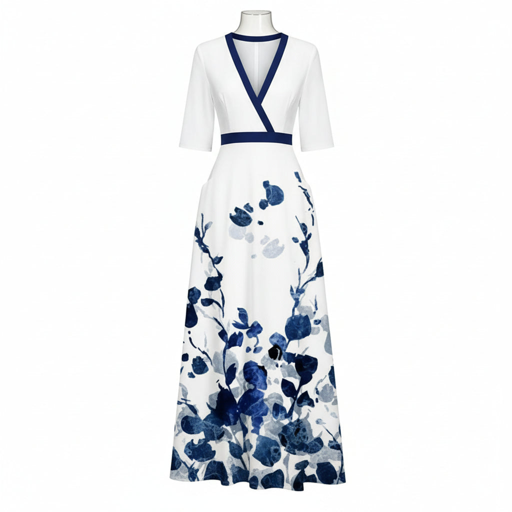 Woman wearing a white dress with blue floral patterns on a dark background