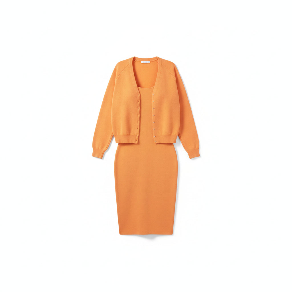 Person wearing an orange outfit standing against a light gray wall.