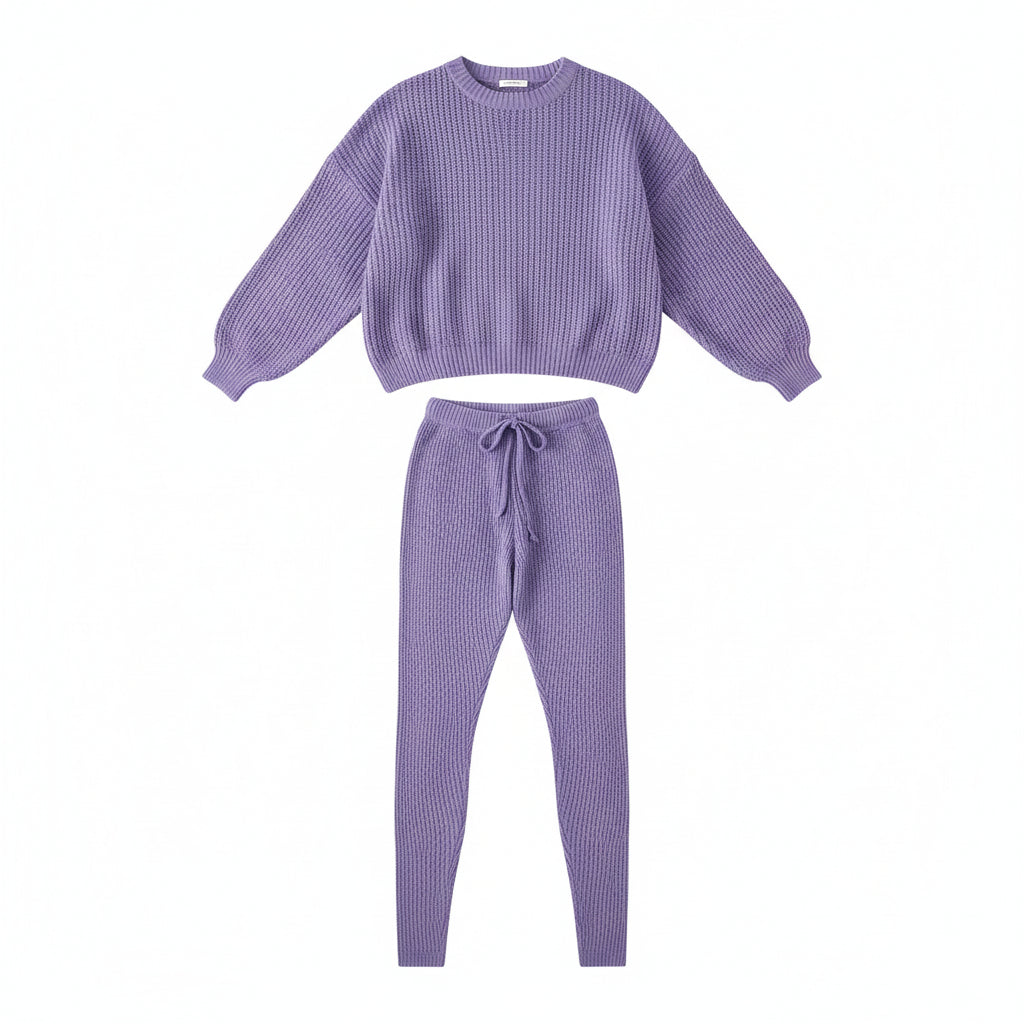 Person wearing a purple knit outfit in a living room setting.