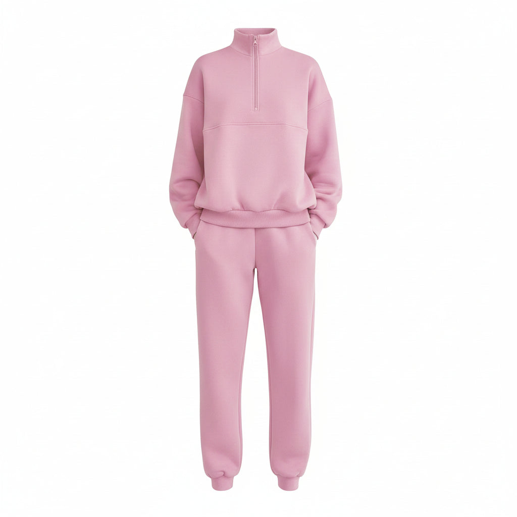 Person wearing a pink tracksuit standing in front of a glass door.