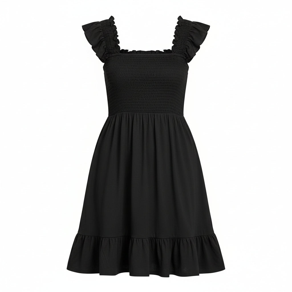 Woman wearing a black dress with ruffled shoulders against a plain background