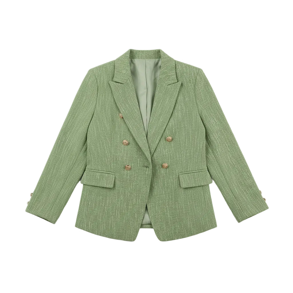 Person wearing a green blazer with a white handbag on a white background