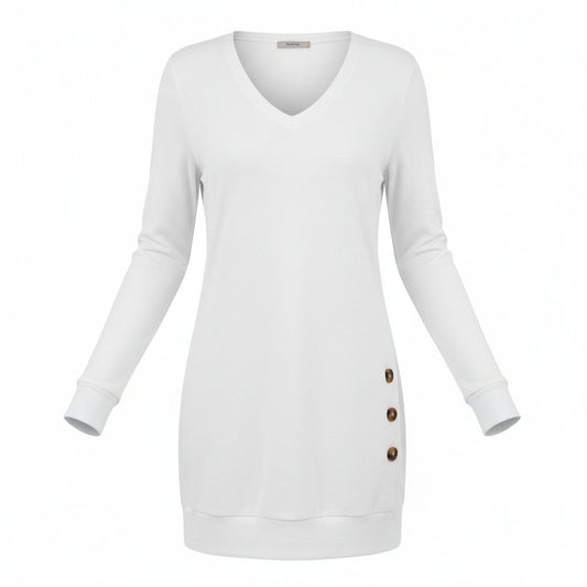 A woman wearing a white long-sleeve V-neck sweater with three dark brown buttons on the side, paired with blue jeans.