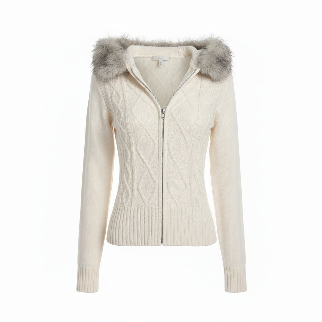 Woman wearing a cream-colored knit cardigan with fur accents indoors.