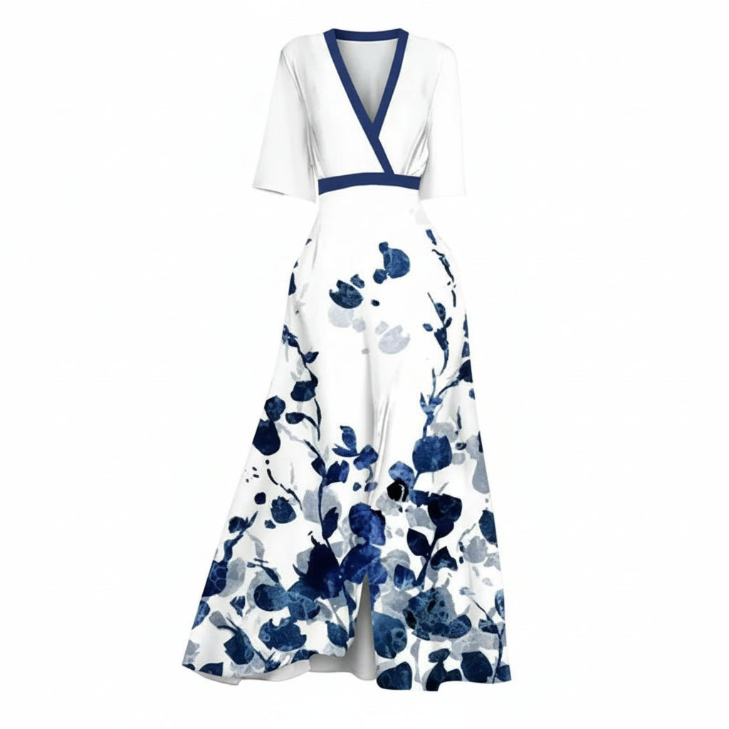 Woman wearing a white dress with blue floral patterns on a dark background